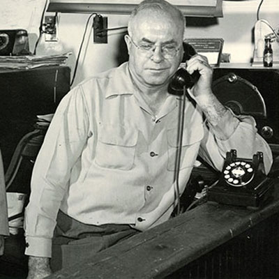man using old rotary phone